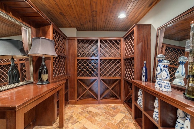9104 Atwater Cv, Austin, TX 78733 - wine area with wooden ceiling, stone tile floors, and recessed lighting