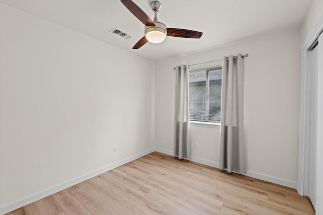 unfurnished bedroom with light wood-style flooring, baseboards, visible vents, and ceiling fan