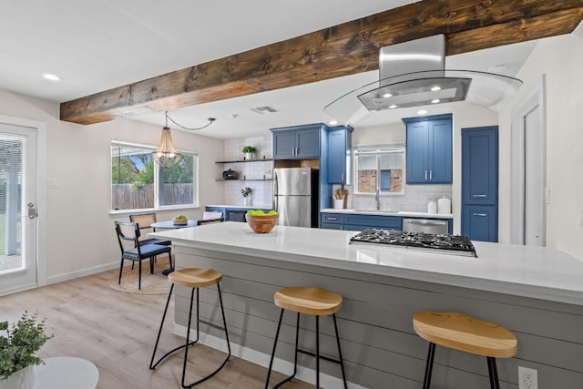 kitchen with blue cabinets, beam ceiling, open shelves, a sink, and stainless steel appliances