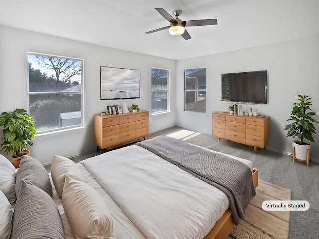 bedroom featuring wood finished floors and ceiling fan