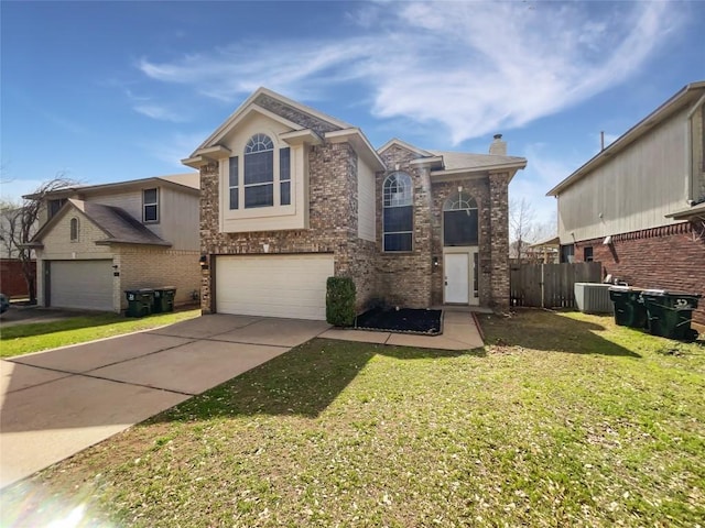 traditional home featuring central air condition unit, a front lawn, driveway, a garage, and brick siding