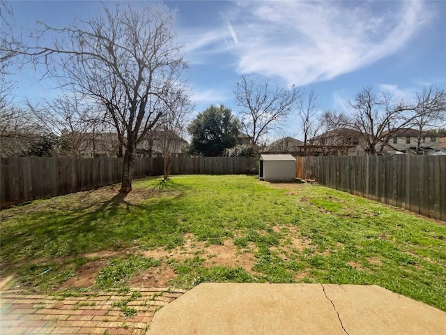 view of yard with a fenced backyard, a shed, a patio, and an outdoor structure