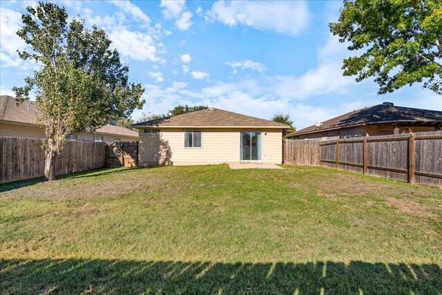 304 Watergate Way, Hutto, TX 78634 - back of house with a lawn and a fenced backyard