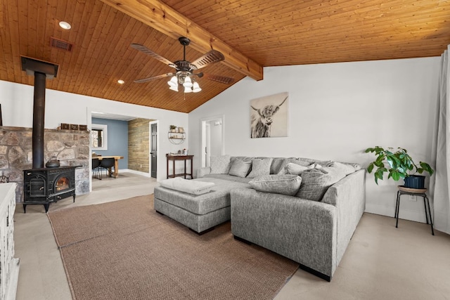 living area with wooden ceiling, a wood stove, vaulted ceiling with beams, and ceiling fan