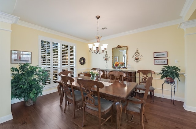 dining room featuring visible vents, dark wood-style flooring, and ornamental molding