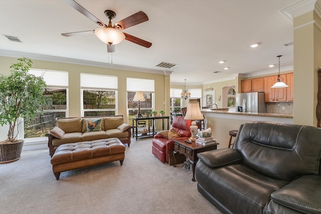 living room with light colored carpet, visible vents, and ornamental molding