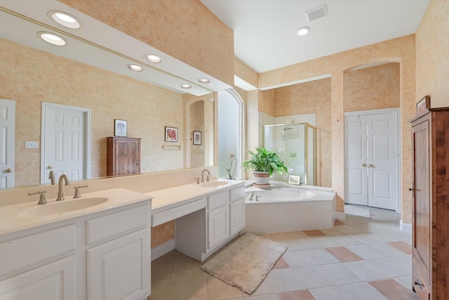 bathroom featuring a sink, visible vents, a stall shower, and double vanity