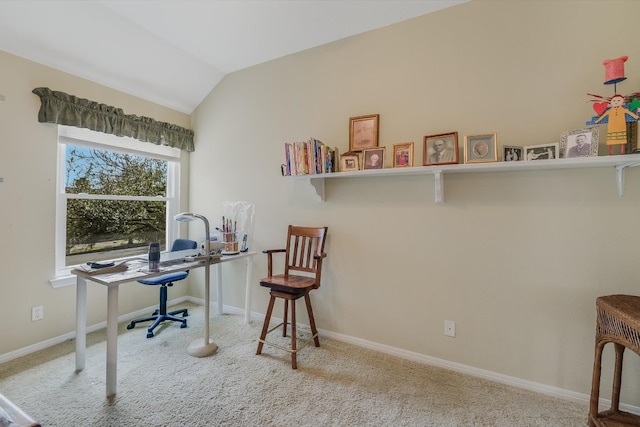 carpeted office space with baseboards and lofted ceiling