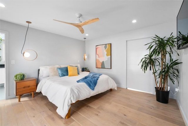 bedroom featuring recessed lighting, baseboards, and light wood-style floors