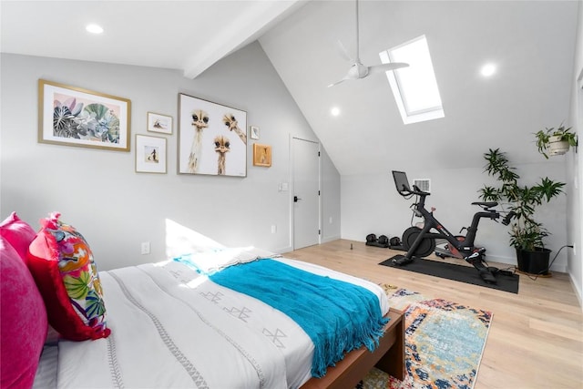 bedroom with recessed lighting, lofted ceiling with skylight, and wood finished floors