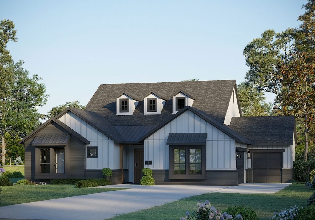 view of front facade with a front lawn, board and batten siding, concrete driveway, an attached garage, and a shingled roof