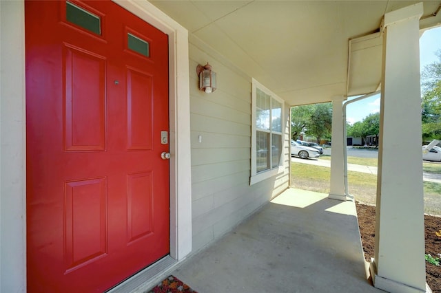 doorway to property featuring a porch