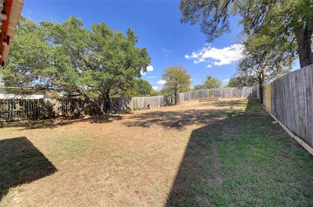 view of yard with a fenced backyard