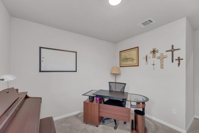 office space with visible vents, carpet flooring, and baseboards