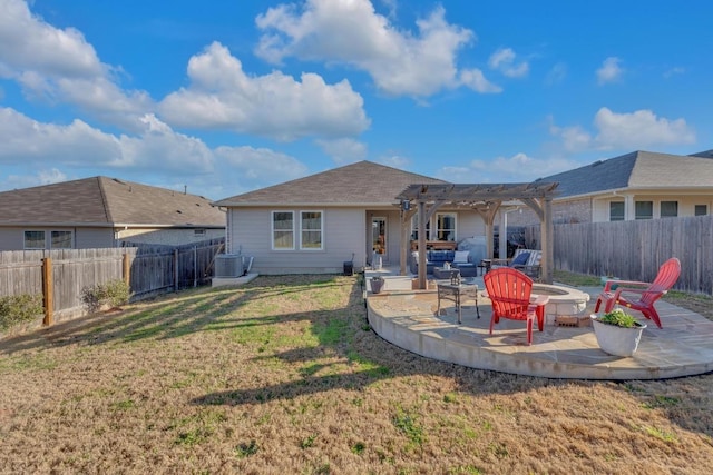 back of property with a patio area, a pergola, a fenced backyard, and a lawn