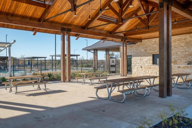 view of property's community with a patio and fence