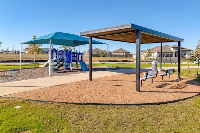 communal playground featuring a yard