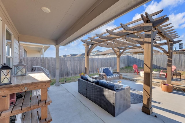 view of patio with outdoor lounge area, a fenced backyard, and a pergola