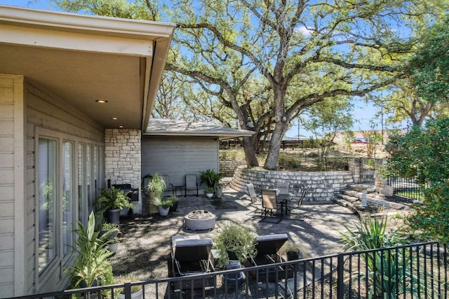 view of patio / terrace featuring fence