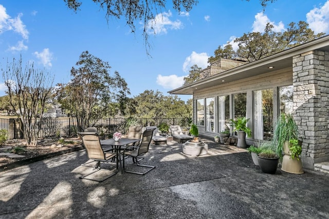 view of patio featuring fence