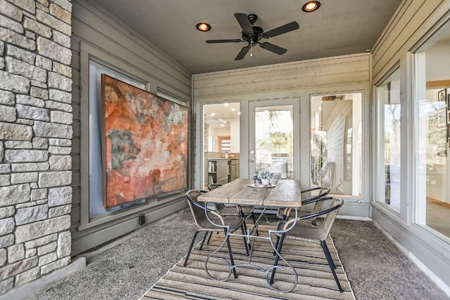 sunroom featuring a ceiling fan