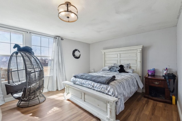 bedroom featuring wood finished floors