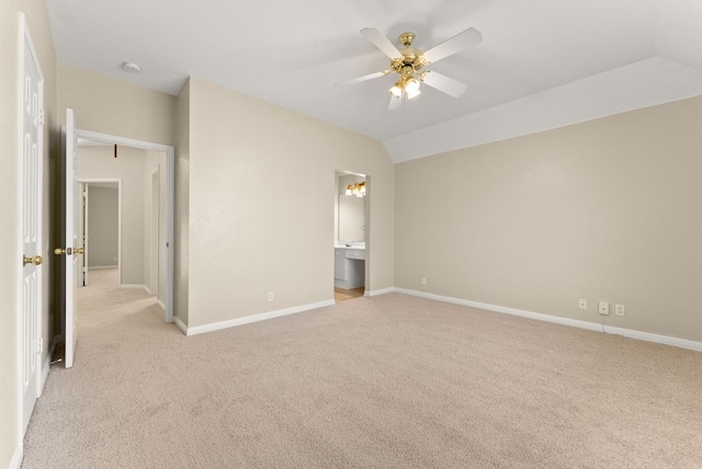 3405 Mulberry Creek Dr, Austin, TX 78732 - unfurnished bedroom featuring light colored carpet, baseboards, lofted ceiling, and connected bathroom