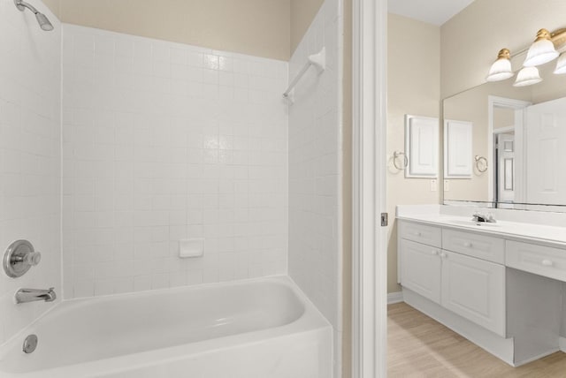 3405 Mulberry Creek Dr, Austin, TX 78732 - full bathroom featuring vanity,  shower combination, and wood finished floors