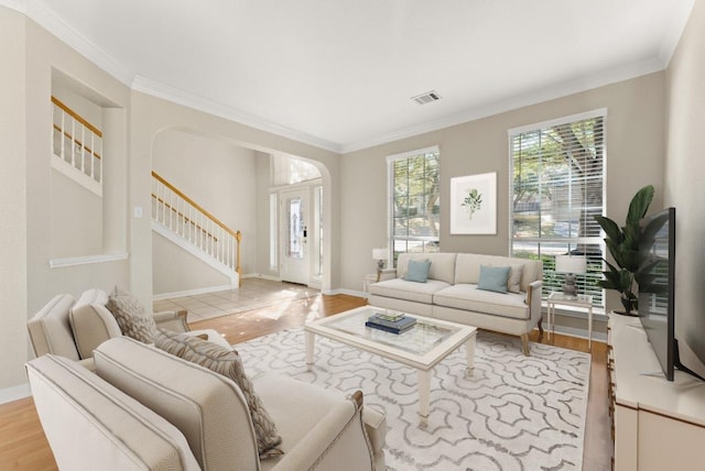 3405 Mulberry Creek Dr, Austin, TX 78732 - living area featuring stairway, light wood-type flooring, crown molding, and baseboards
