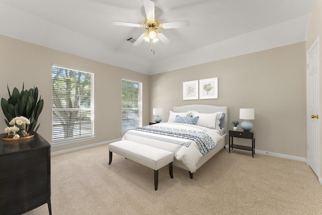 carpeted bedroom with visible vents, ceiling fan, and baseboards