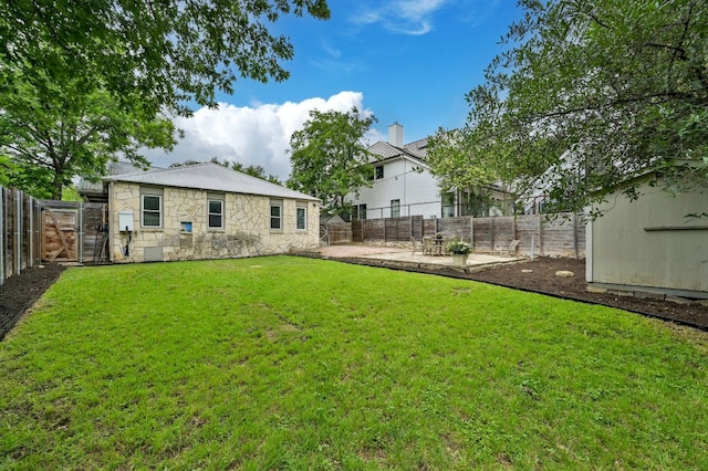 view of yard with a patio and a fenced backyard