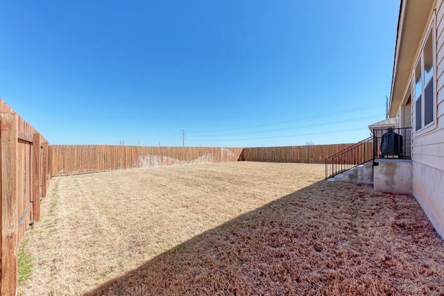 view of yard with a fenced backyard