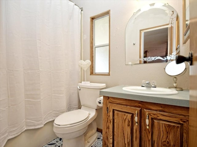 bathroom with a shower with shower curtain, toilet, and vanity