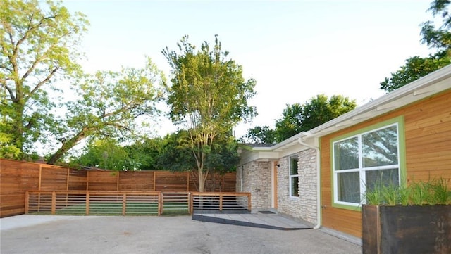 view of patio featuring fence