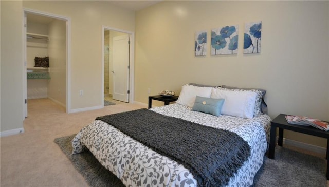 bedroom with baseboards and carpet floors