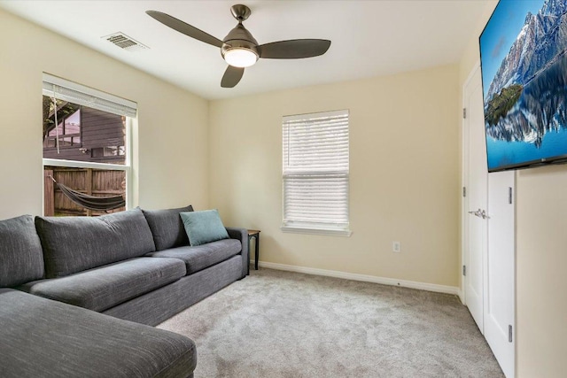 1705 E 14th St Unit B, Austin, TX 78702 - carpeted living area with ceiling fan and baseboards