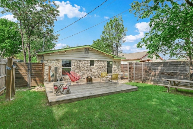 1705 E 14th St Unit B, Austin, TX 78702 - rear view of house featuring stone siding and a deck