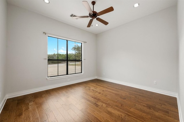 unfurnished room with recessed lighting, baseboards, a ceiling fan, and dark wood-style flooring