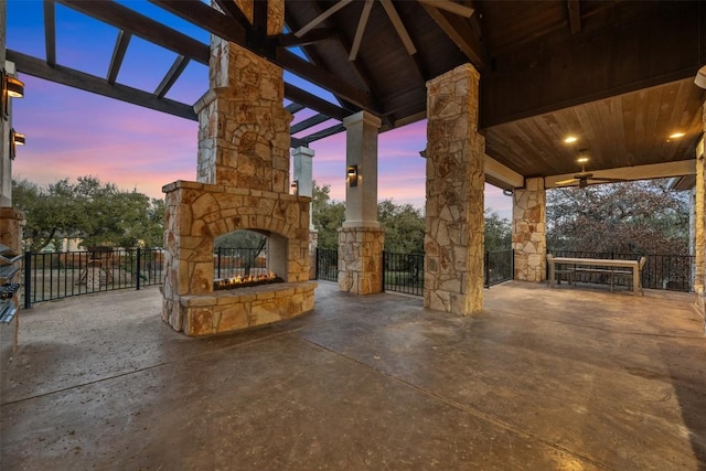 view of patio / terrace featuring an outdoor stone fireplace