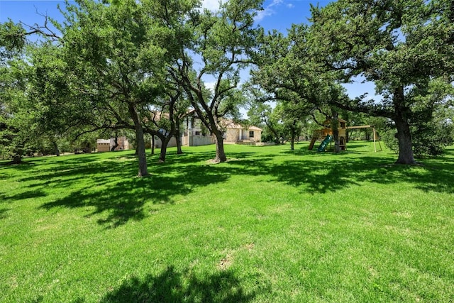 view of yard featuring playground community