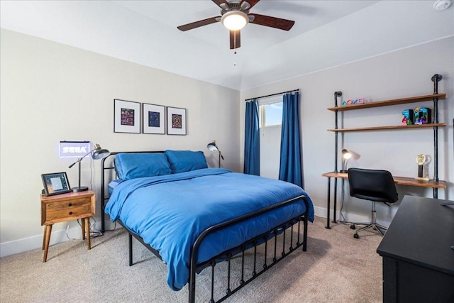 bedroom with light colored carpet, baseboards, and ceiling fan