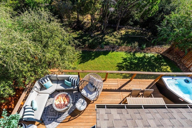 wooden deck with an outdoor living space with a fire pit, an outdoor hot tub, and fence