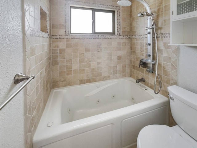 11510 Powder Mill Trl, Austin, TX 78750 - bathroom featuring toilet, a combined bath / shower with jetted tub, and a textured wall