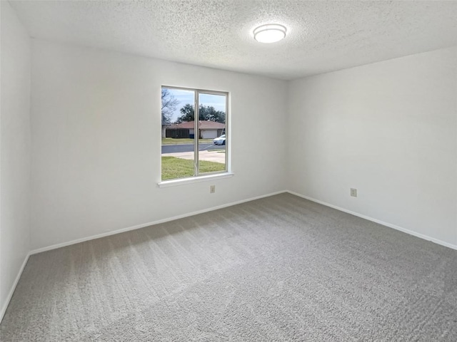 11510 Powder Mill Trl, Austin, TX 78750 - empty room with a textured ceiling, carpet, and baseboards