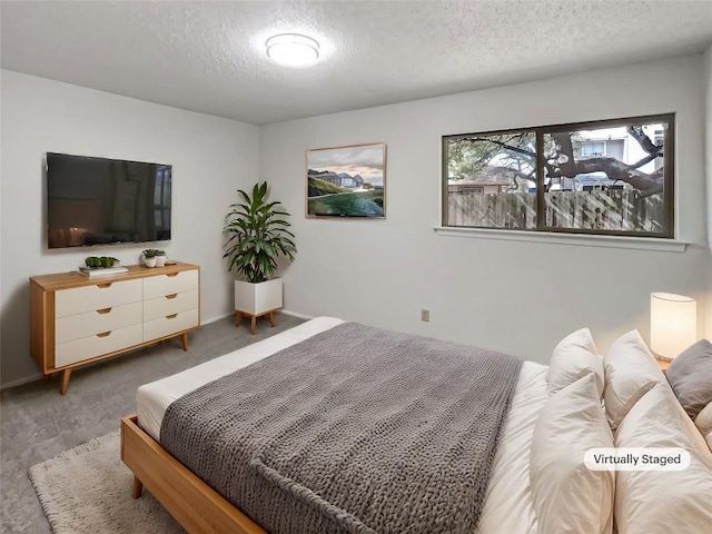 11510 Powder Mill Trl, Austin, TX 78750 - bedroom with a textured ceiling, carpet flooring, and baseboards