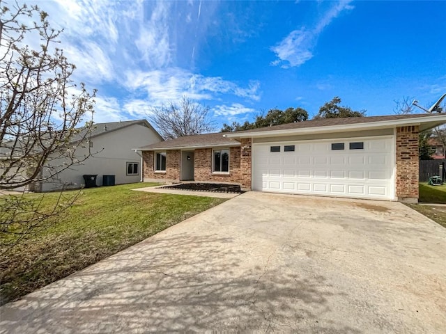 11510 Powder Mill Trl, Austin, TX 78750 - single story home featuring driveway, brick siding, an attached garage, and a front yard