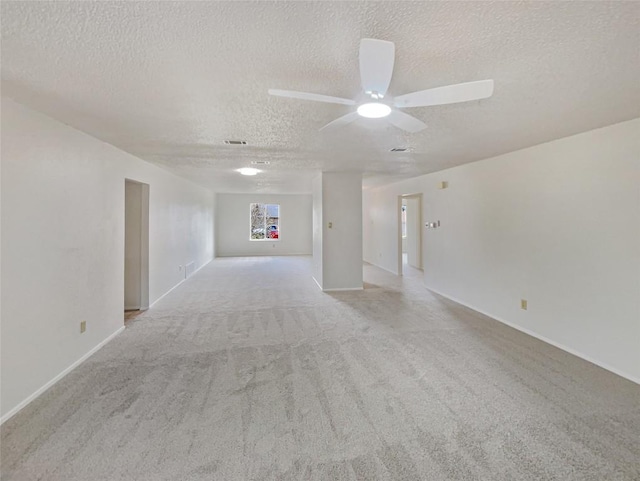 11510 Powder Mill Trl, Austin, TX 78750 - unfurnished room with a textured ceiling, carpet, a ceiling fan, and baseboards