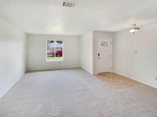 11510 Powder Mill Trl, Austin, TX 78750 - unfurnished room with carpet flooring, a textured ceiling, and baseboards