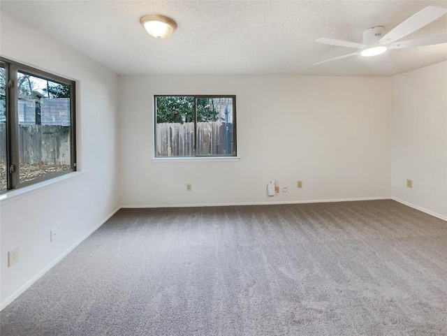 11510 Powder Mill Trl, Austin, TX 78750 - carpeted empty room featuring a ceiling fan, baseboards, and a textured ceiling