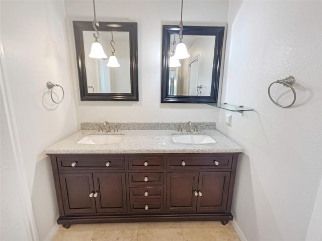 11510 Powder Mill Trl, Austin, TX 78750 - bathroom featuring double vanity, tile patterned floors, and baseboards